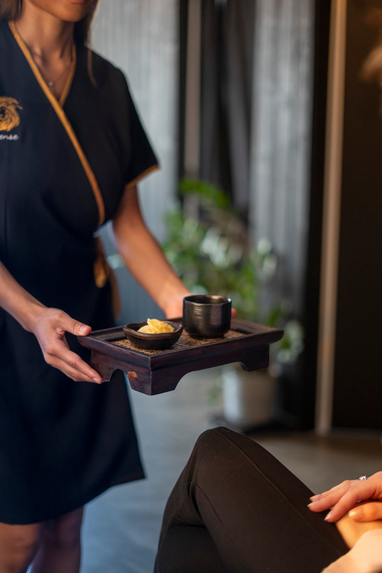 Warm hospitality details at Sense — herbal tea and towels