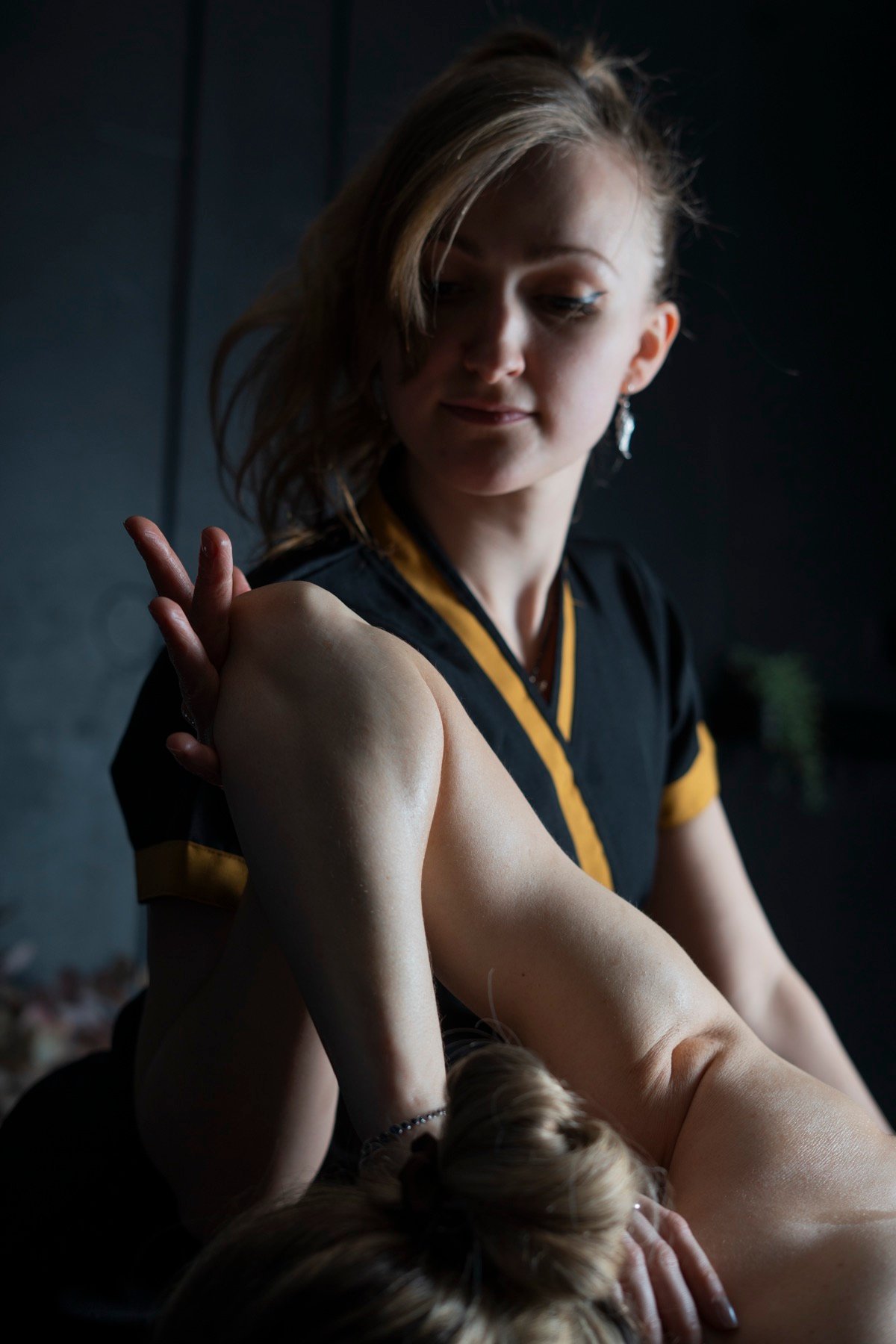 Therapist performing Thai remedial deep tissue work on the lower back